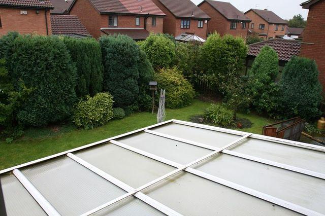Back garden looking over conservatory.
