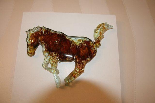 Glass horse on dining room wall.