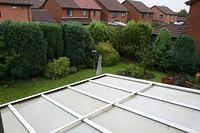 Back garden looking over conservatory.